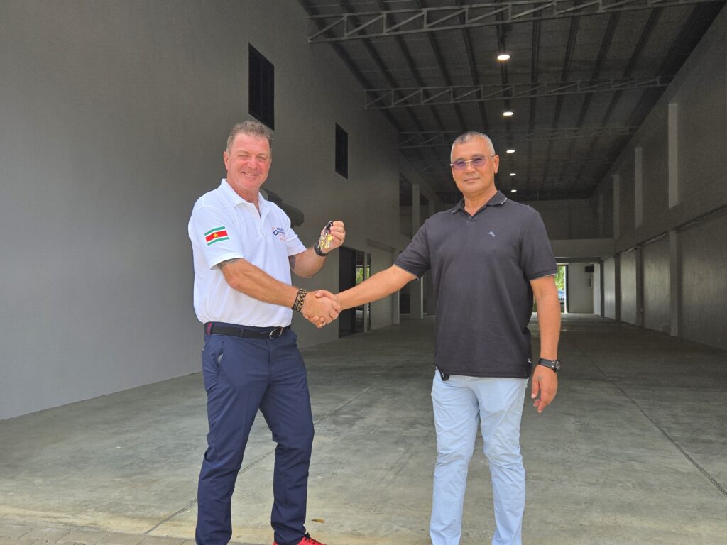 Mr. Kevin Hall, our Country and Business Development Manager, taking possession of the keys to our newly built offices and warehouse in Suriname.